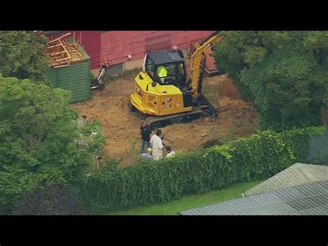 Excavator seen digging in backyard of man charged in Gilgo Beach killings